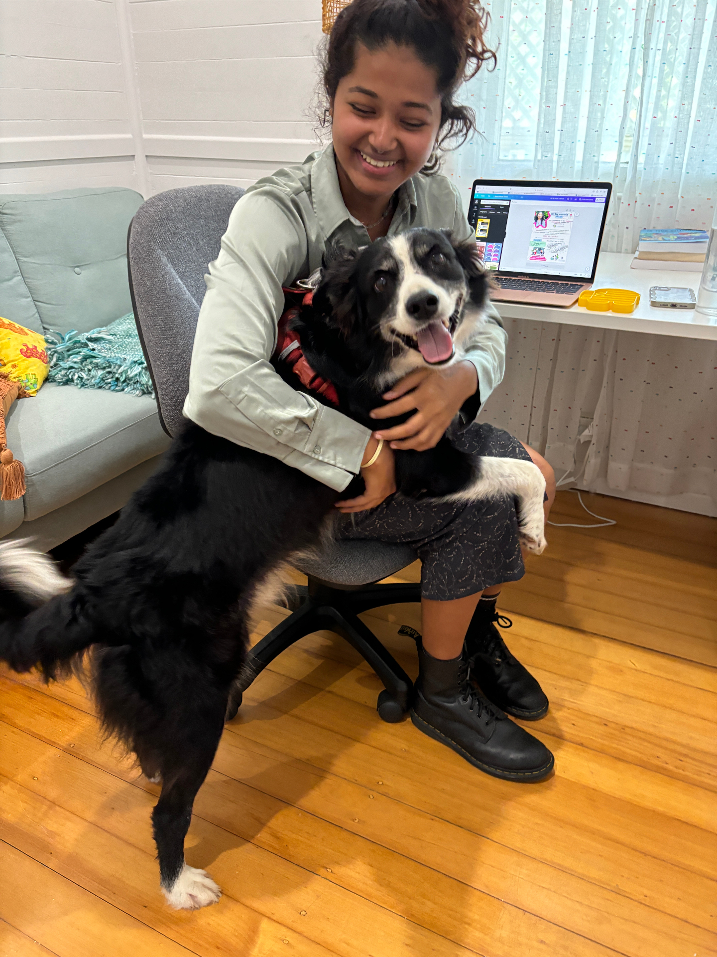 Team member hugging our therapy dog